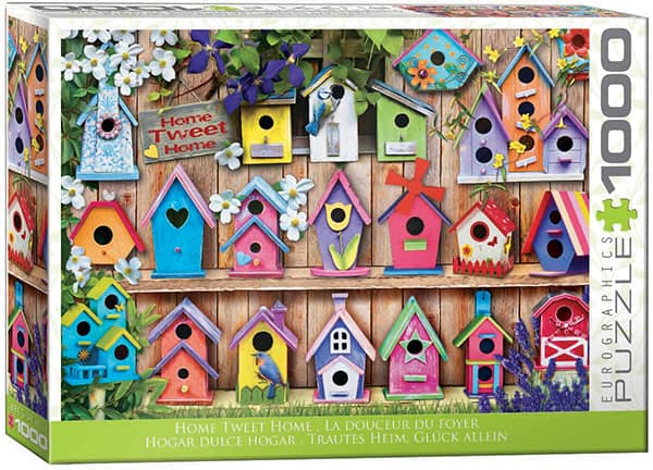 Home Tweet Home -palapeli, jossa värikkäitä linnunpönttöjä, jotka ovat kuin pieniä mökkejä. Palapelissä on 1000 palaa. Valmistaja Eurographics