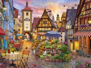 Romanttinen Baijeri palapeli (Romantic Bavaria) on Schmidtin 1000-palainen. Etelä-Saksassa sijaitsee Baijerin osavaltio, jonka vanhojen kaupunkien talot viehättävät. Pelin kuvassa on kukkamyyjän kojut, kahvilat ovat tuoneet pöydät ja tuolit ulos, ilta-aurinko on laskenut talojen taakse.