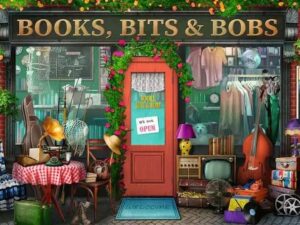 Books, Bits & Bobs palapeli on Ravensburgerin 1000-palainen. Kuvassa kaupan eteen on tuotu pöytä, vanha gramofoni, puhelin, tv, soittimia ja leluja. Ovessa lukee "Avoinna". 
