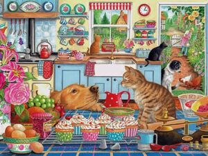 Tempting Treats -palapeli: Keittiössä kuppikakut odottavat koristeltuina, kissat ja koirat vain katsovat. Ihastuttavan tunnelman tarjoaa Gibsonsin palapeli.