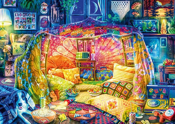 Aimee Stewart Kotoisa maja palapeli (A cosy den) on värikäs ja Stewartille tyypillinen kuva, jossa on paljon yksityiskohtia. Maja olohuoneessa on kiehtovan värikäs ja tunnelmallinen palapeli.